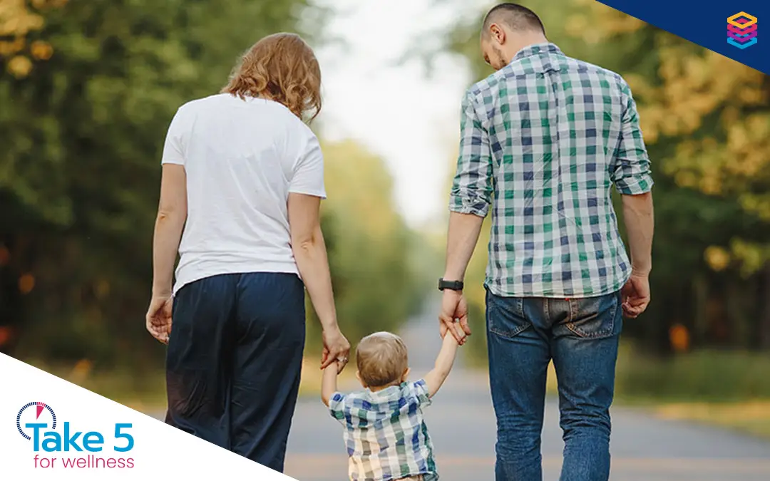 Dont-get-caught-short-during-leaves | Mother and father walking with their toddler - Benefits Alliance