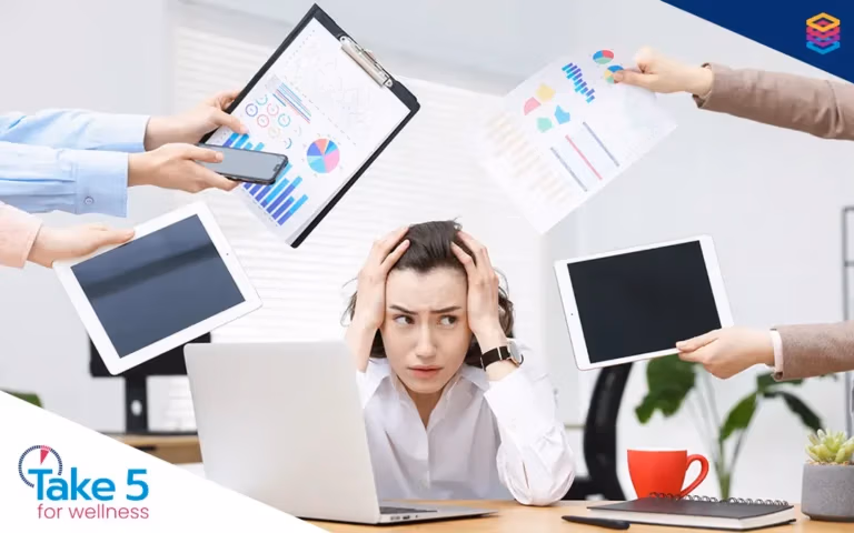 workplace challenges | Stressed and overworked female employee - Benefits Alliance
