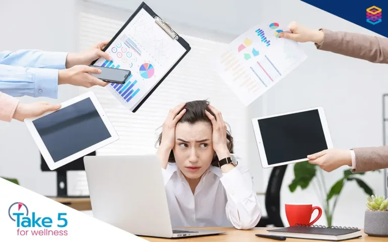 workplace challenges | Stressed and overworked female employee - Benefits Alliance