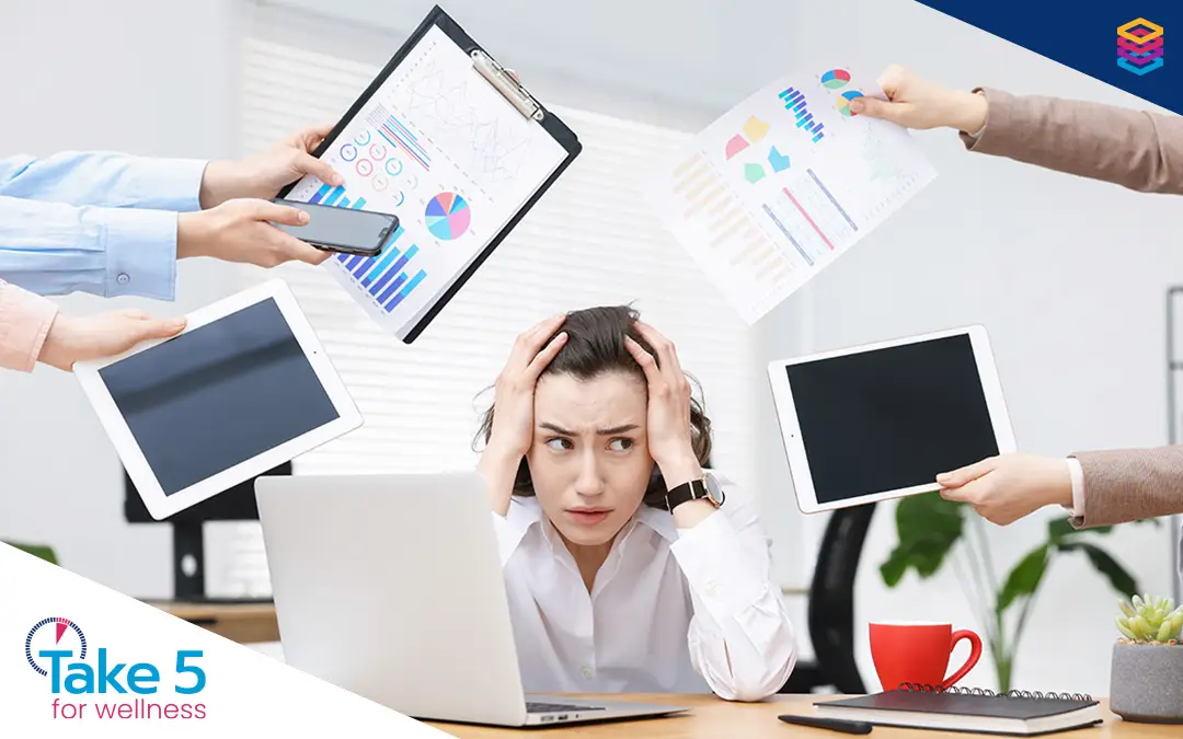 workplace challenges | Stressed and overworked female employee - Benefits Alliance